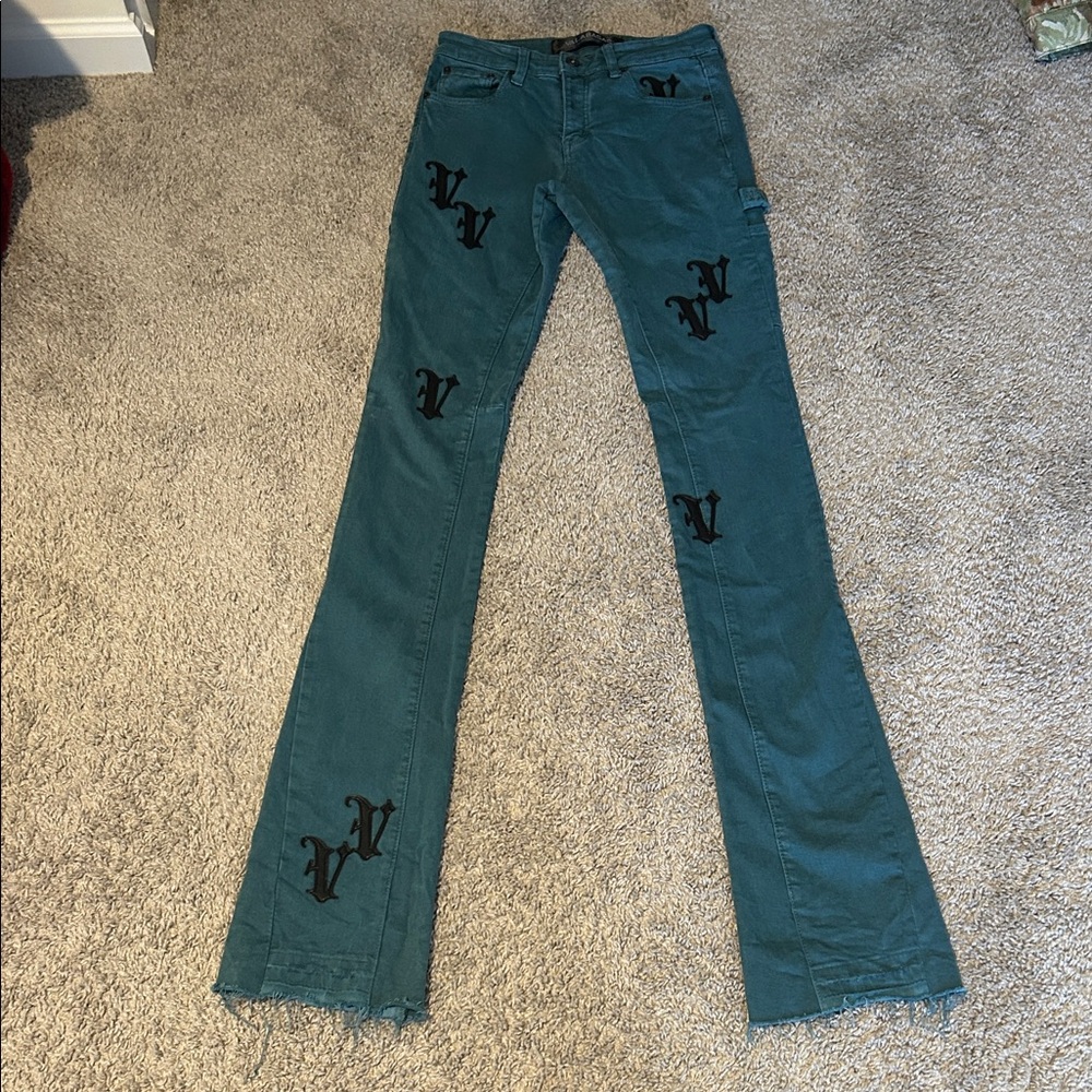 Stylish Teal Stacked Flare Jeans with Black Accents